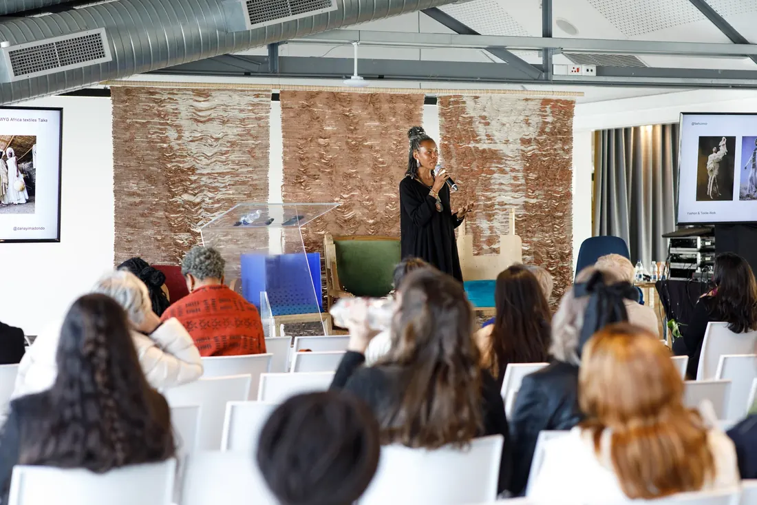 Founder speaking to a seated audience