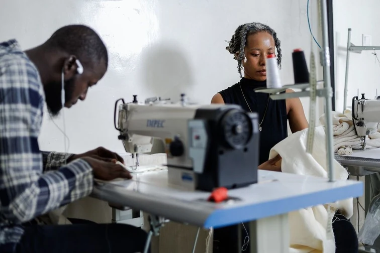 Studio sewing — two makers at industrial machines