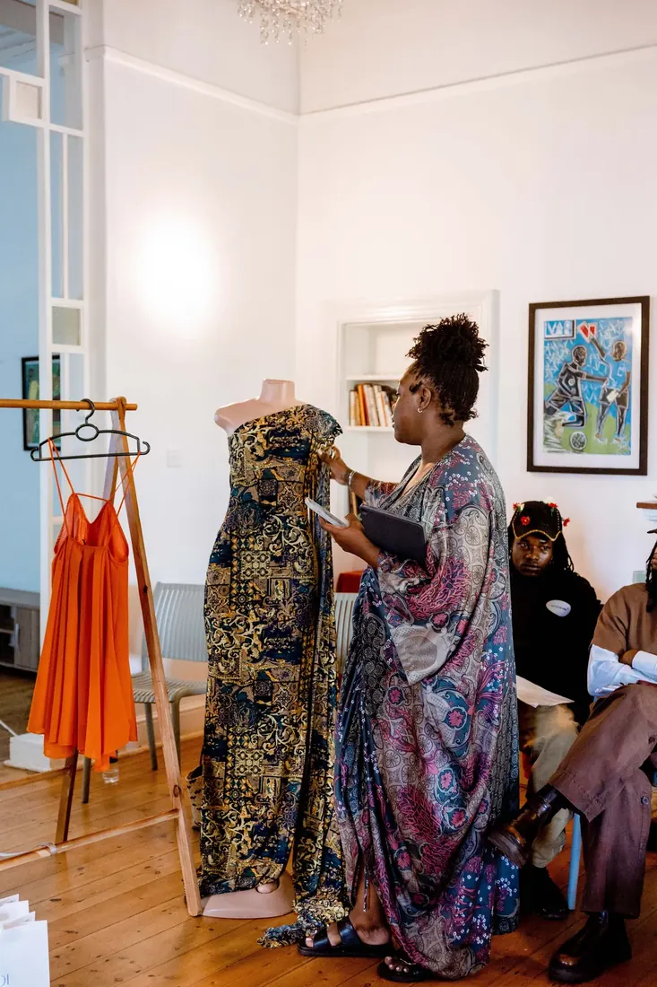 Founder presenting to a seated audience at a Fashion Conversation session